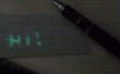 Macht eine LED UV reagierende Schreibfläche und Stift berühren
