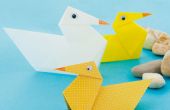 Papier Falten wie zu: Enten auf einem See schaukeln