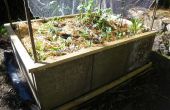 Macht ein Gartenbett angehoben aus Betonstein